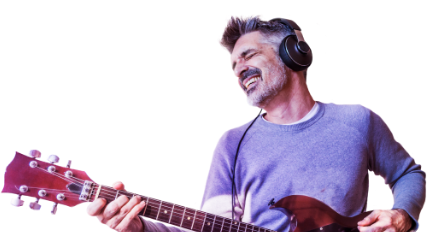 man wearing headphones while playing the guitar